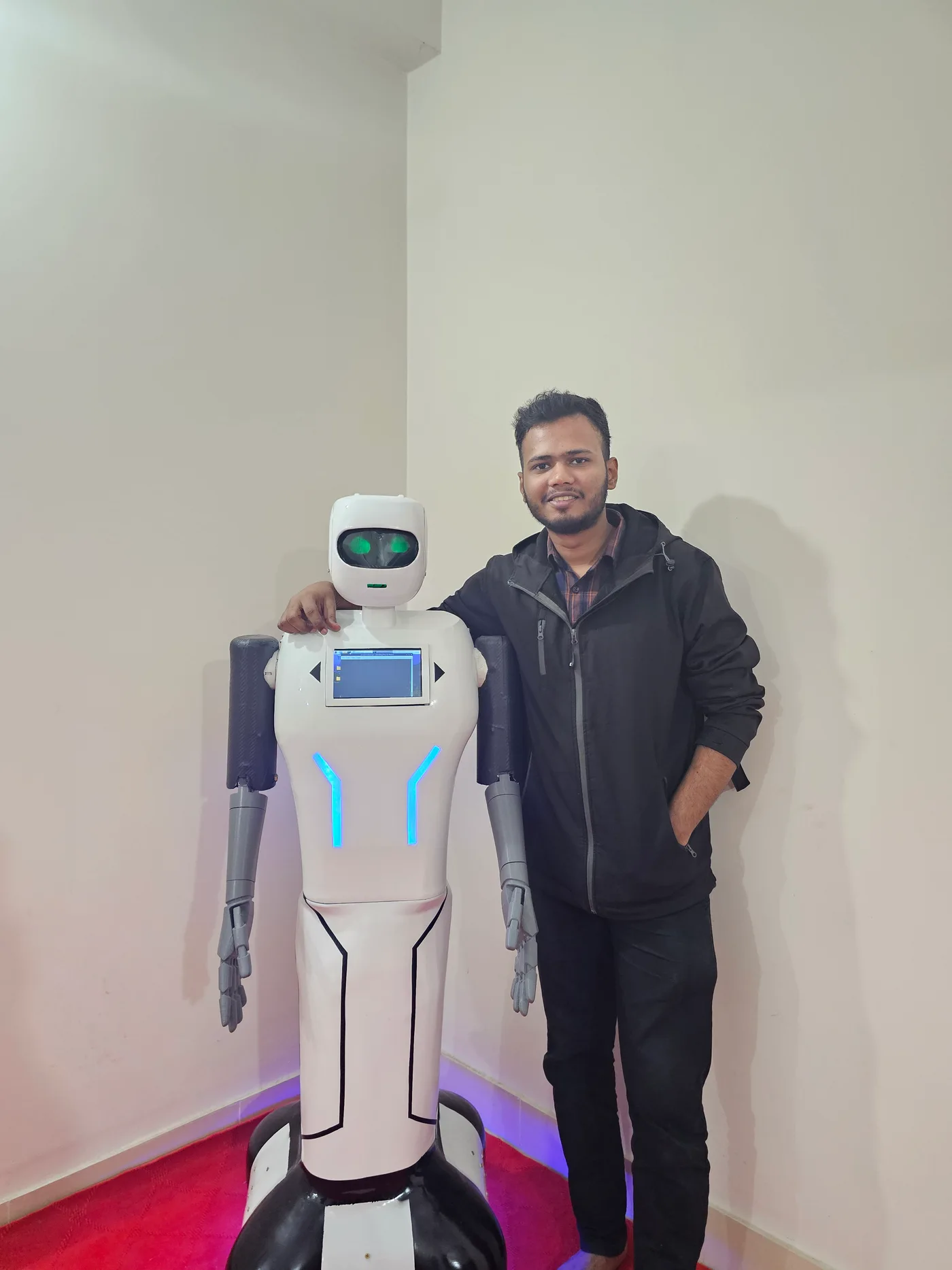 Ratul Hasan with the Pixi v2.0 humanoid robot